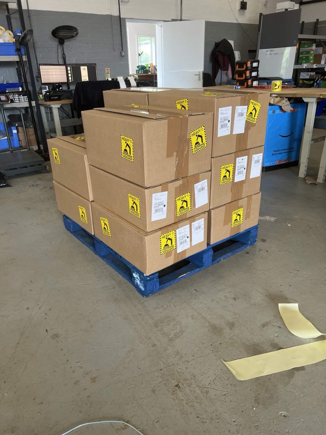 Cartons picked, labelled and stacked on a pallet at the Fortem Group packing bench
